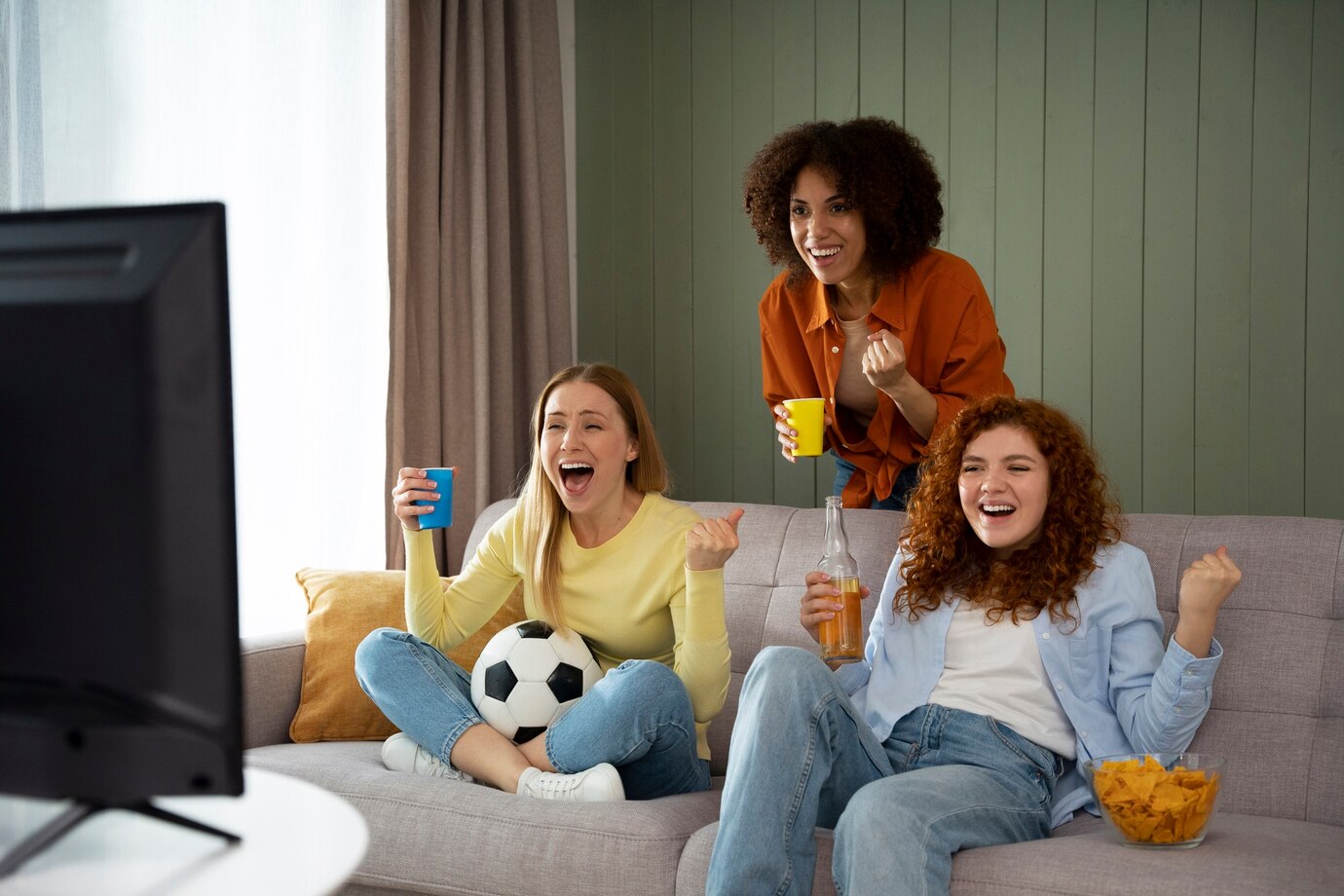group-female-friends-home-watching-sports-together_23-2150168017